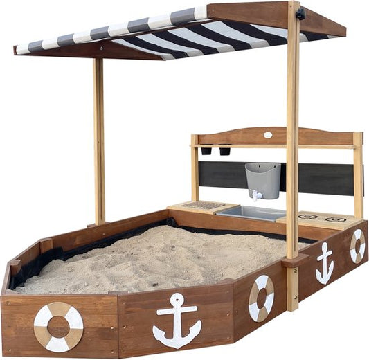 Bac à sable AXI Dora Boot avec cuisine ludique et toit (UV50) 160 x 100 cm Anthracite/marron – Avec tableau noir et espace de rangement - Toile de protection incluse - Garantie 10 ans !