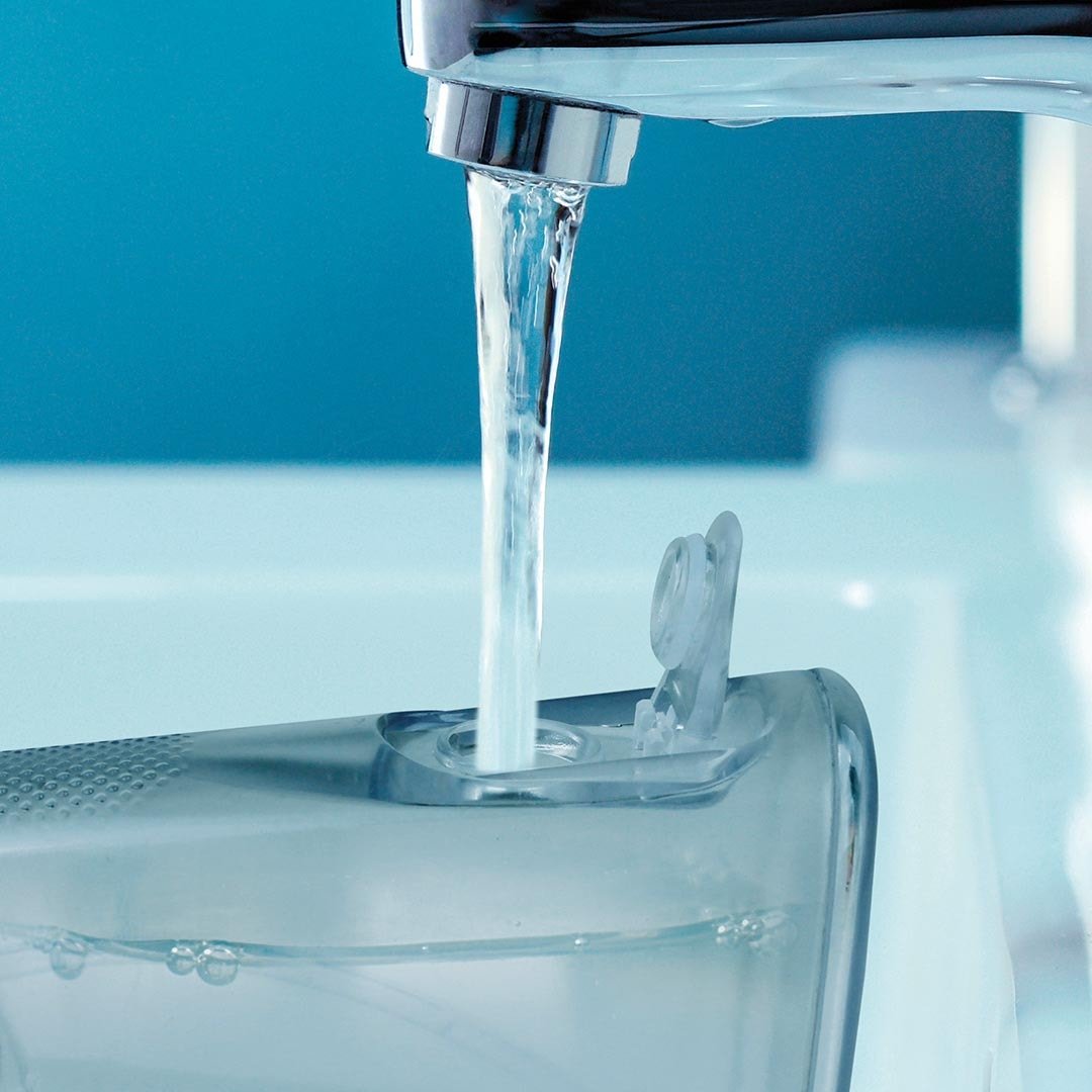 Douche buccale électrique CorpCare MiracleSmile - Embout en forme de H - Modèle sans fil - Réservoir d'eau pratique