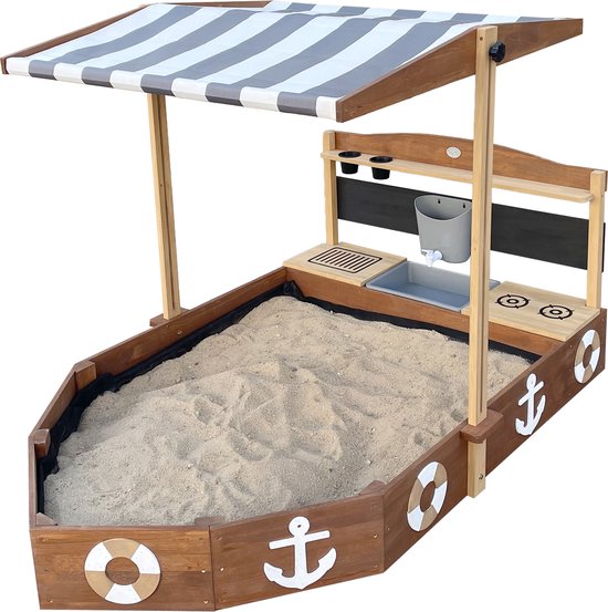 Bac à sable AXI Dora Boot avec cuisine ludique et toit (UV50) 160 x 100 cm Anthracite/marron – Avec tableau noir et espace de rangement - Toile de protection incluse - Garantie 10 ans !