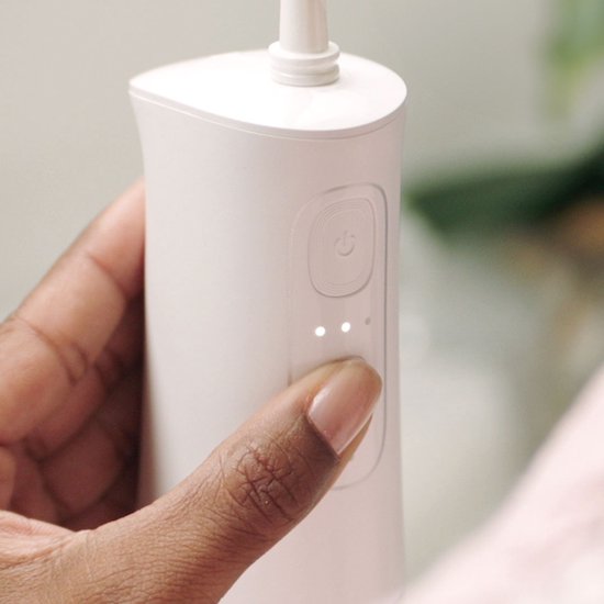 Douche dentaire électrique CorpCare MiracleSmile – Rechargeable, pression d'eau réglable, embout en forme de H, compacte et étanche, idéale pour les gencives sensibles