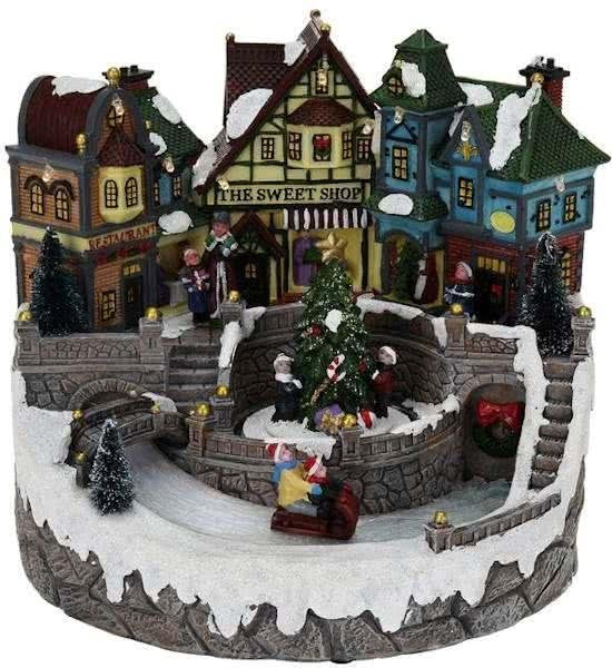 Village de Noël avec lumières et mouvement