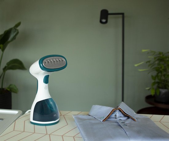 Tomado TSH1201W - Défroisseur linge - Défroisseur mains - Démêleur - Nettoyeur vapeur - 2 brosses incluses - Blanc/turquoise