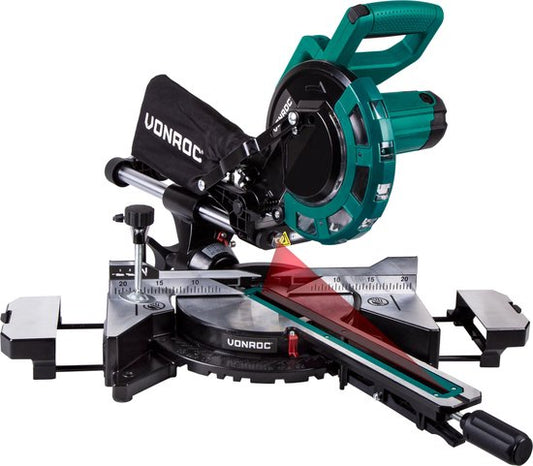 Tronçonneuse et scie à onglets VONROC avec fonction de traction - 2000W - Ø216MM - Eclairage LED sur la pièce - Laser pour une ligne de coupe parfaite - Largeur de coupe supplémentaire 340mm - Rallonges de table réglables avec butée de longueur - Lame de