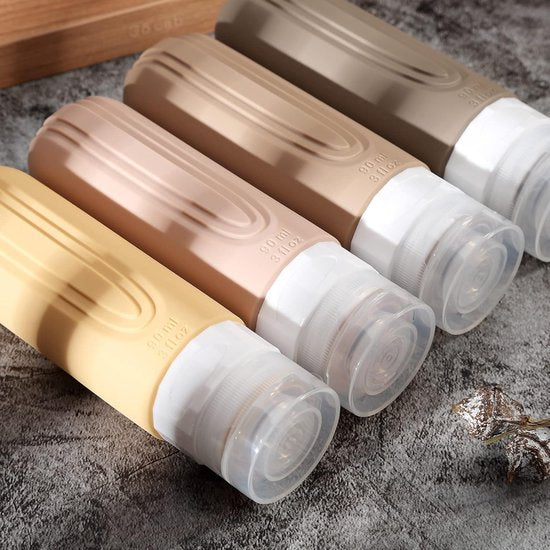 EverNeeds Bouteilles de voyage avec étui - rechargeables - Bouteilles de voyage en silicone pour bagages à main - crème - 4 pièces