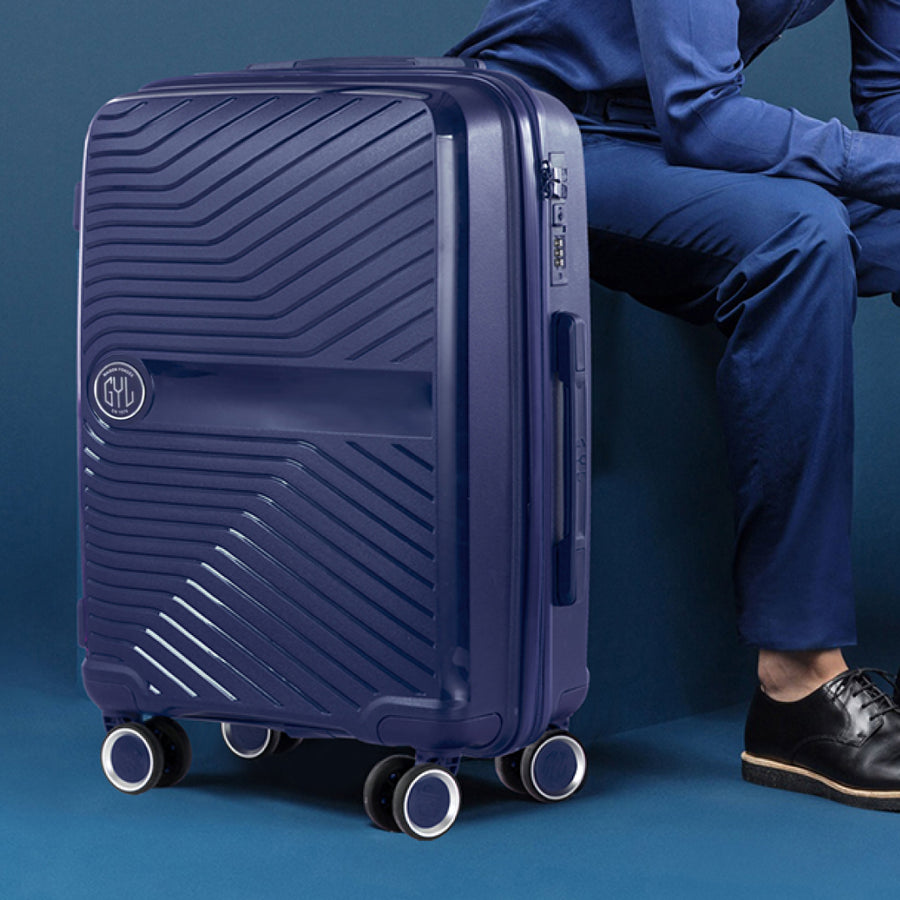 VALISE RIGIDE BLEUE DE TAILLE MOYENNE (TAILLE M)