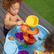 Table à eau Step2 avec toboggan en spirale 66 x 66 x 57,1 cm – Bleu/Rouge – Lot d'accessoires de 13 pièces