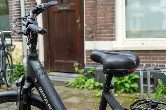 Selle de vélo Voltano avec coussinets en gel - Noir/Rouge - Découpe - Suspension - Unisexe - Sangle de selle incluse